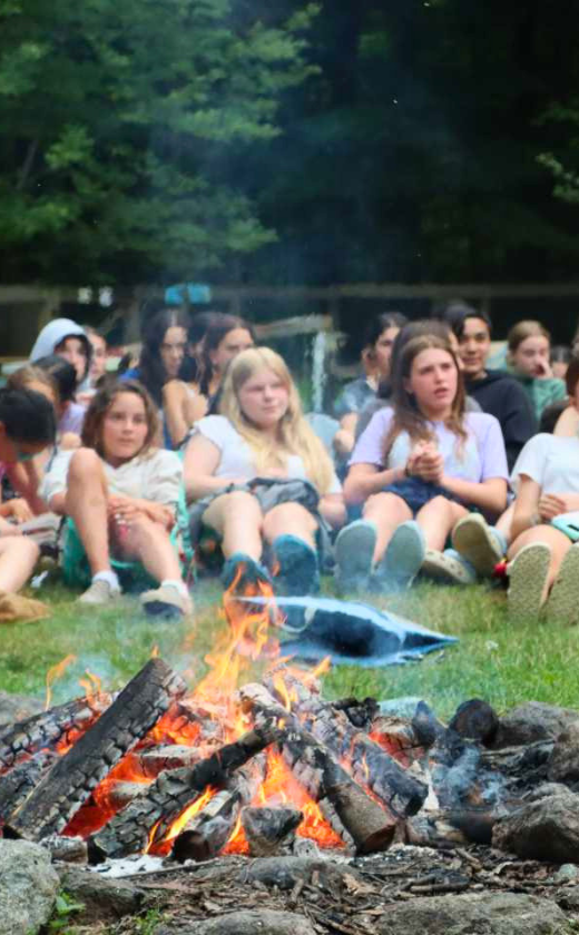 Campfire at summer camp. Sleepaway camp in New Hampshire